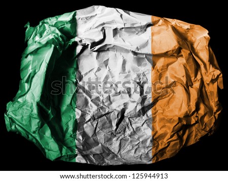 Ireland. Irish flag  painted on crumpled paper on black background