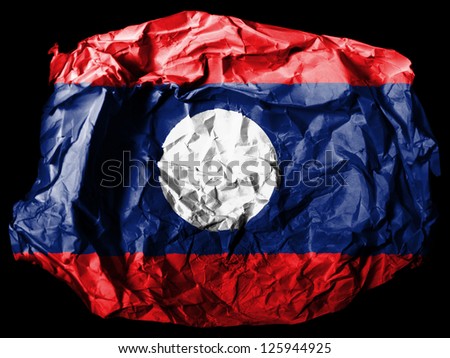 The Laotian flag  painted on crumpled paper on black background