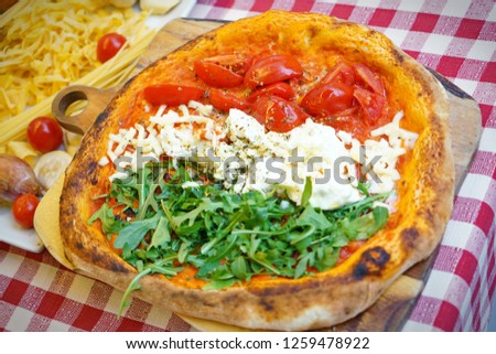 Patriotic Italian tricolore pizza with stripes of red, white and green in the colours of the national flag
