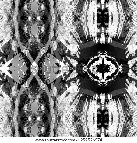 Geometric black and white abstract kaleidoscope pattern for textiles and design.