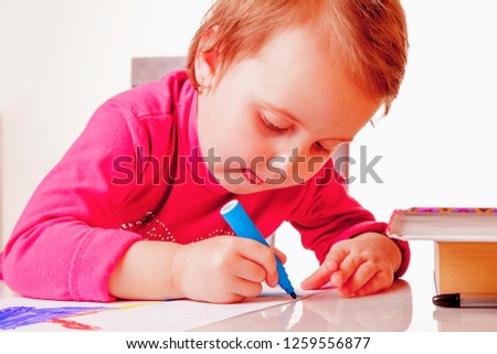 Great artist. Portrait of child girl draws felt-tip pens. Art, creative, talent, education,  happy childhood concept.