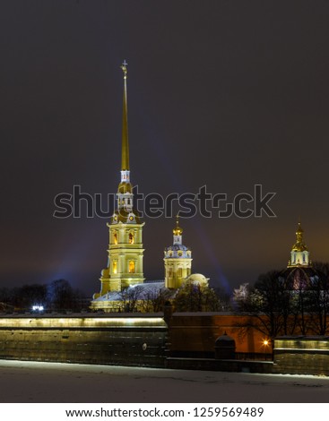 spire of the Peter and Paul fortress on the background of sunset glow, night, beautiful lighting, horizontal shot. Symbol of Saint Petersburg, Russia