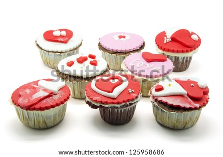 Gourmet cupcakes with hearts and decorations