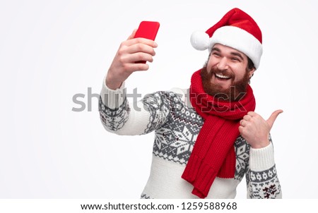 Stylish and modern Santa waiting for christmas and taking a selfie picture isolated on white background
