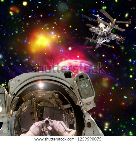Astronaut and space station. Wonderful view of space. The elements of this image furnished by NASA.