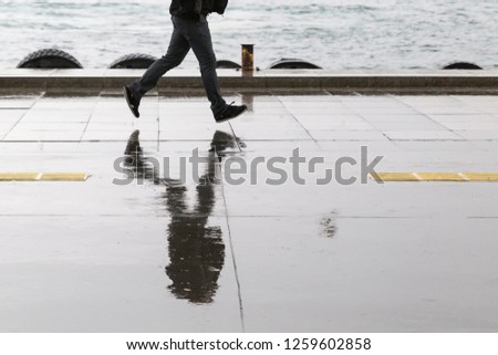 Man running in the rain. November 24, 2014 Istanbul