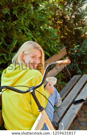 Young blonde woman in Park. Spring or summer season. Free and happy teenager girl. Good weather