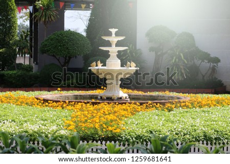 a beautiful fountain in green park