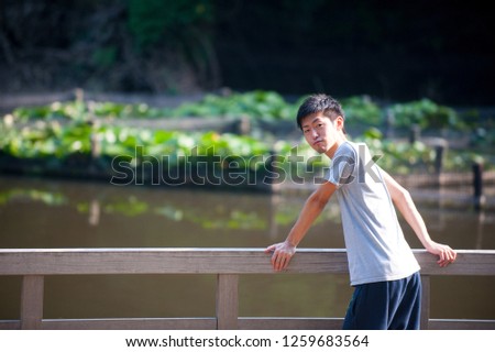 Asian male model poses for pictures on the street