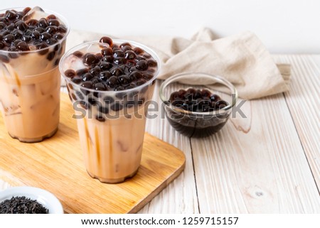 Taiwan milk tea with bubble on wood background Royalty-Free Stock Photo #1259715157