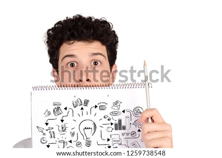 Close up of a young student holding notebook with idea sketch and pencil. Creative and innovation concept. Isolated white background.