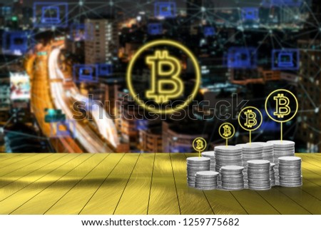 Digital money with bitcoin symbol and network connection concept with blurred cityscape background

