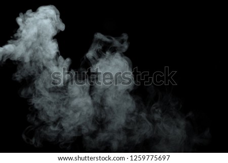 Abstract powder or smoke isolated on black background,Out of focus
