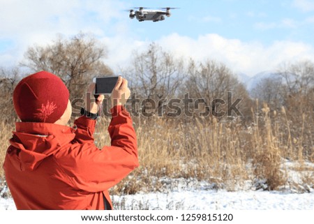 man playing with drone 