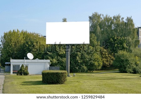 The urban metal mass production empty  billboard for outdoor modern LED advertizing. Sunny summer urban day landscape.