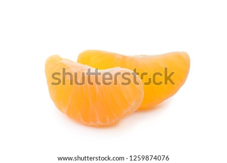 Pieces of fresh ripe tangerine on white background