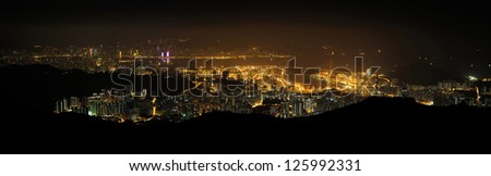 Hong Kong Victoria harbour and Tsuen Wan at night from Tai Mo Shan, the highest hill in Hong Kong