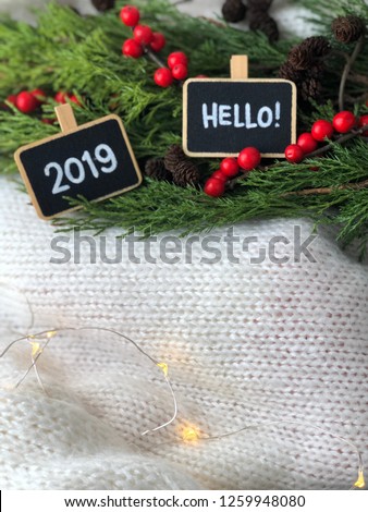 cozy 2019 flatlay with chalkboards and knitted white background