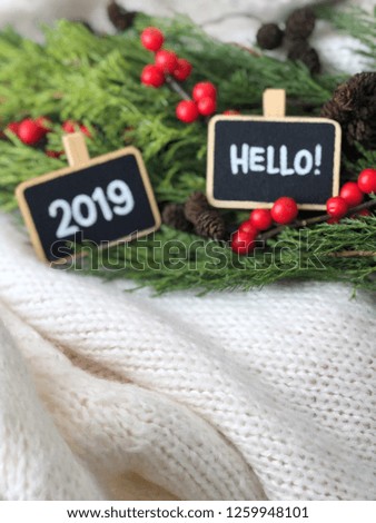 cozy 2019 flatlay with chalkboards and knitted white background