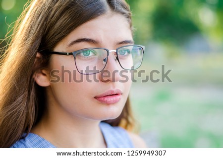 Girl with glasses outdoor. Portrait of a beautiful girl with long hair. Beautiful girl outdoor. tourist girl on a sunny day. 