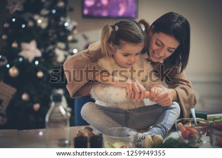 I will help you. Mother and daughter in kitchen for Christmas eve.
