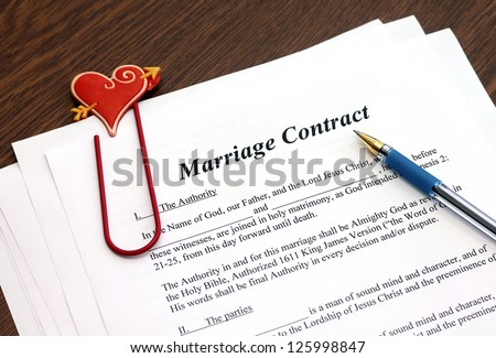 Marriage contract with pen, close-up