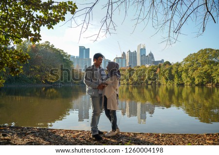 Couple standing in Piedmont Park Atlanta