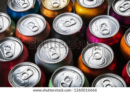 aluminum cans of soda background. the view from the top Royalty-Free Stock Photo #1260016666