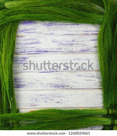 
green grass on a wooden background