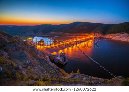 Beautiful view. Sunset. Night lights on the dam of the Yumaguzinsky reservoir on the White River. Bashkortostan