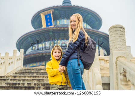 Mom and son travelers in the Temple of Heaven in Beijing. One of the main attractions of Beijing. Traveling with family and kids in China concept
