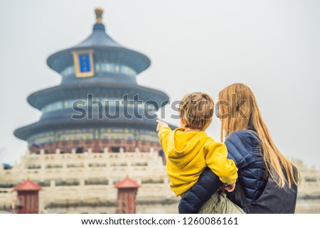 Mom and son travelers in the Temple of Heaven in Beijing. One of the main attractions of Beijing. Traveling with family and kids in China concept