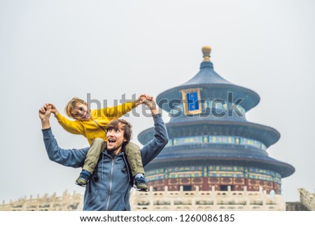 Dad and son travelers in the Temple of Heaven in Beijing. One of the main attractions of Beijing. Traveling with family and kids in China concept