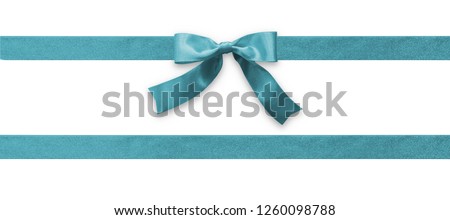 Teal bow ribbon band satin blue fabric (isolated on white background with clipping path) for holiday gift box, wedding greeting card banner, present wrap design decoration 