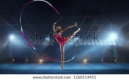 Rhythmic gymnast in professional arena.