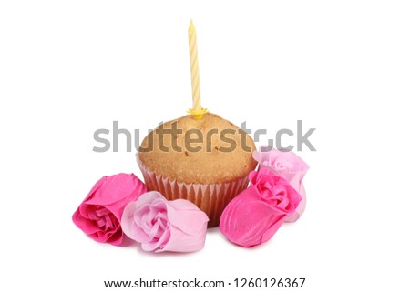 Fresh sweet cupcake with a candle on a white background
