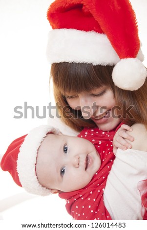 Mother and child smile and celebrate Christmas