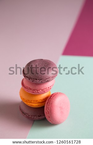 Multi-colored macaroons on a colored background