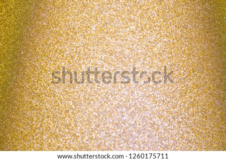 Abstract blur foil golden silver sparkle glitter backdrop. 
Bokeh gradation gold for light Christmas and  happy new year.
top view.