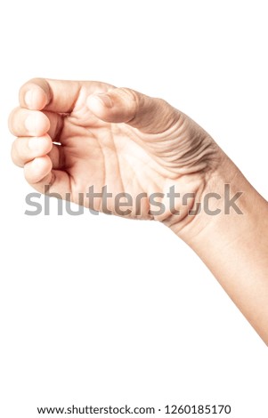 Close up hand holding something like a bottle or can isolated on white background with clipping path.