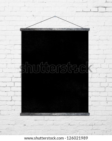 black poster on brick wall