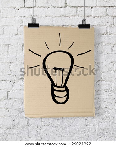 poster with lamp on a brick wall