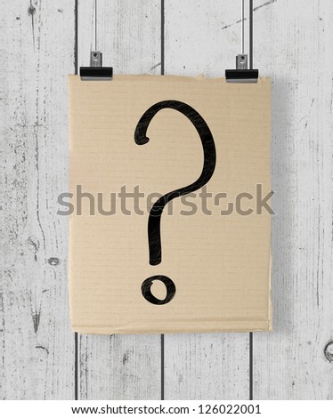 poster with question mark  on a wood wall