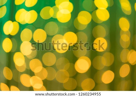 Gradient green and yellow bokeh background.