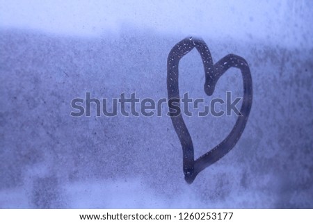 Heart on the glass. Close-up. Background. Texture.