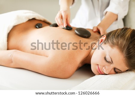 An attractive woman getting spa treatment, isolated on white background Royalty-Free Stock Photo #126026666