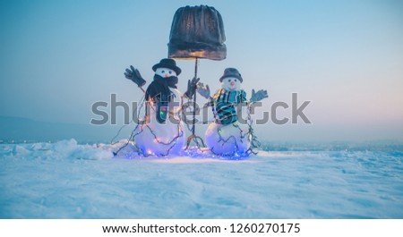 Holiday. Dressed snowmen and a lamp. Great photo about merry Christmas and happy New Year greeting card with snowman