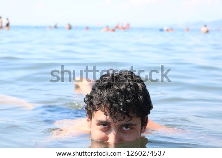 human floating in the sea