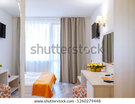 Bright and modern interior of hotel comfortable double room 