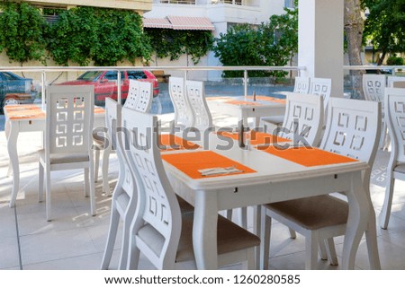 Outdoor cafe interior in white color 